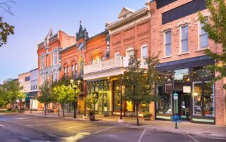 Main street stores at dusk, no cars