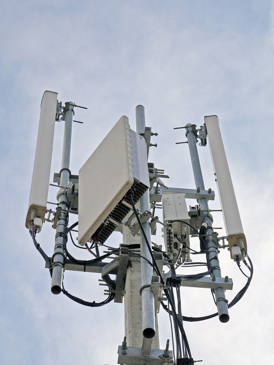 Cell tower upclose 1100×1465 Office building at night