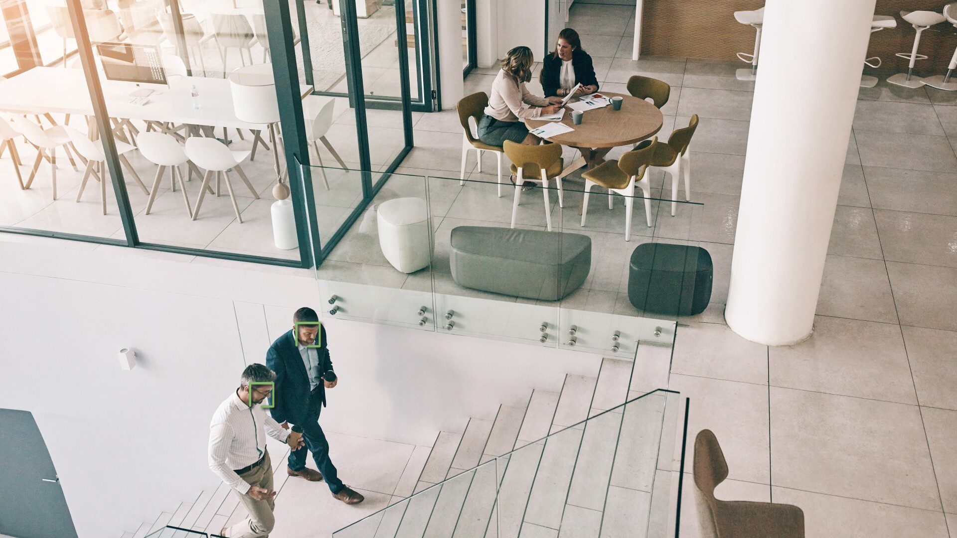 Office setting with two sets of two employees