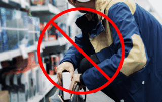Man stealing from a retail store. Image has prohibited symbol overlaid.